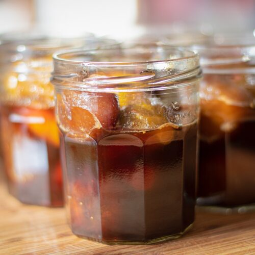 Three open jars of preserved figs